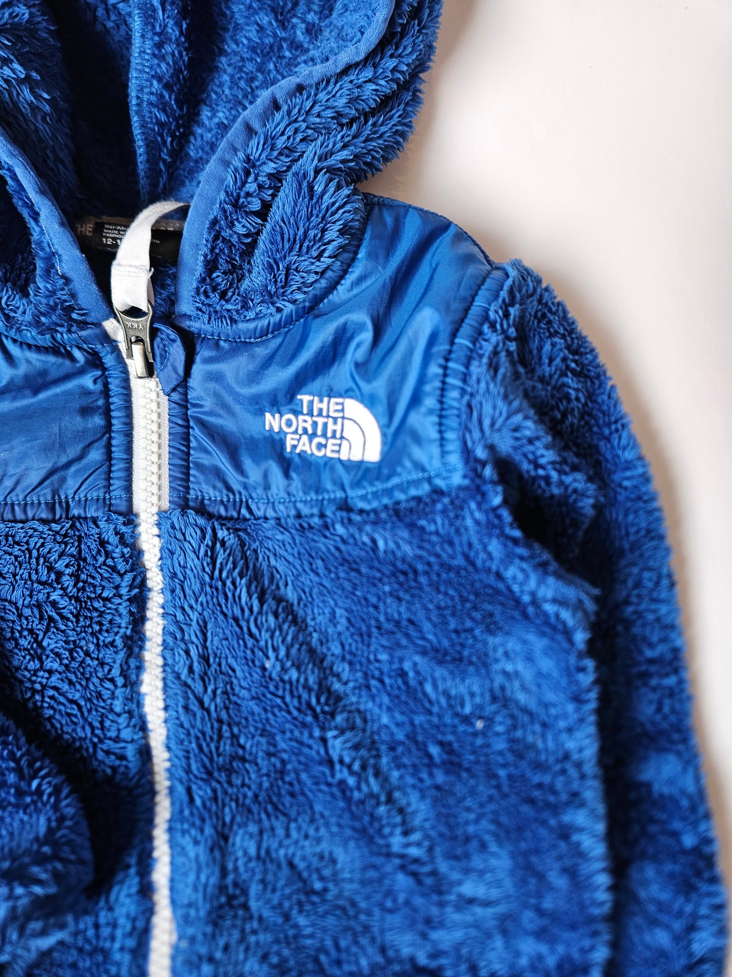 The North Face blue zip-up sweater size 12 to 18m